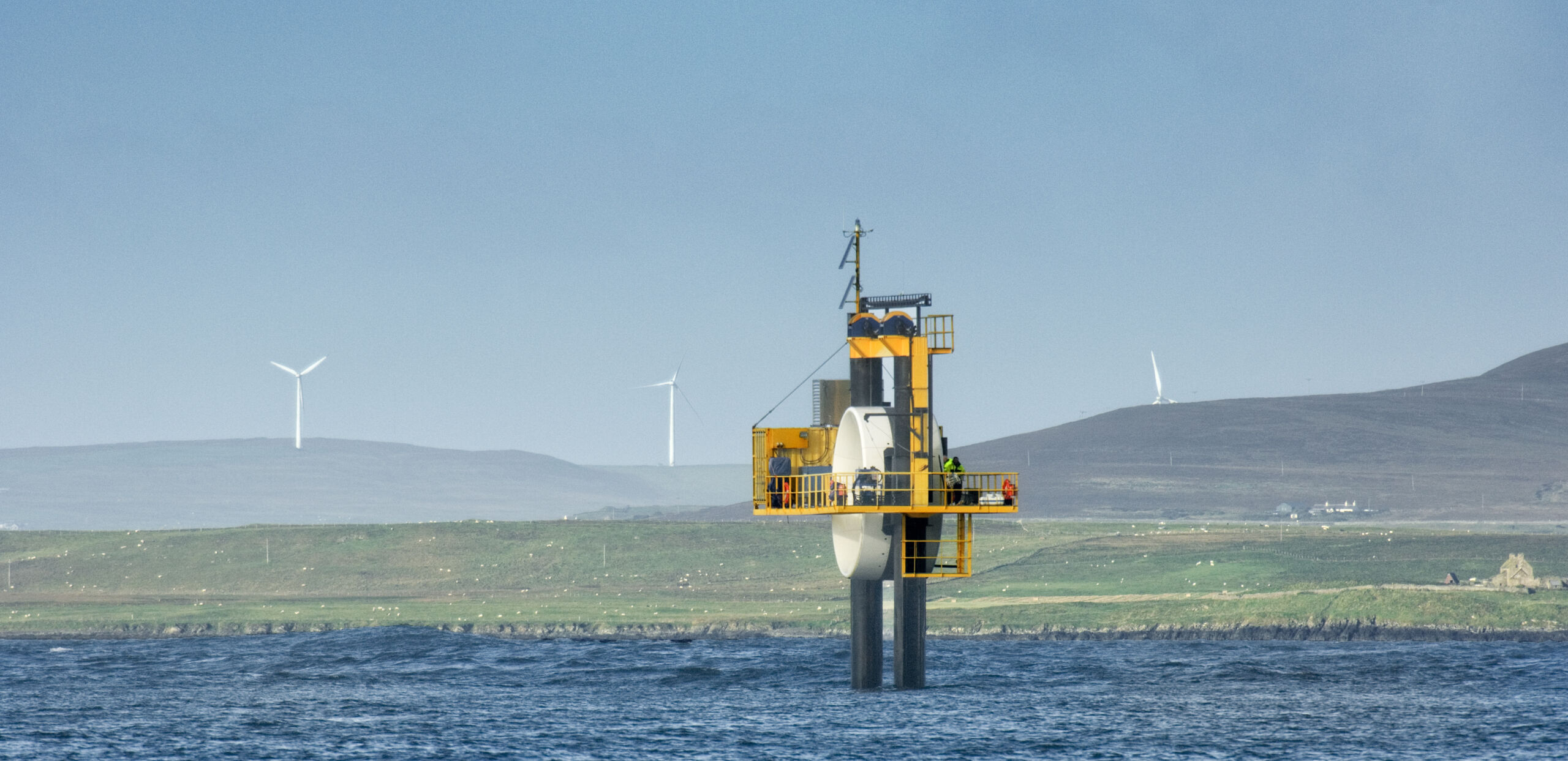 Tidal platform with wind turbines behind